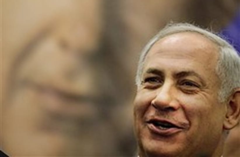 netanyahu with poster great 248.88  (photo credit: AP)