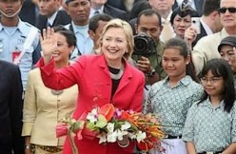 clinton with flowers 248.88 (photo credit: AP)