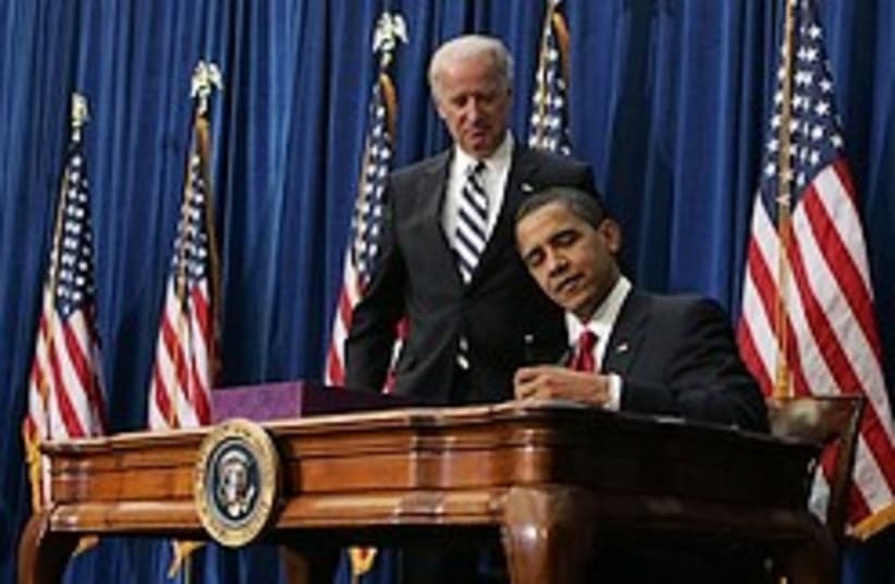 obama signs stimulus bill w biden 248 ap (photo credit: AP)