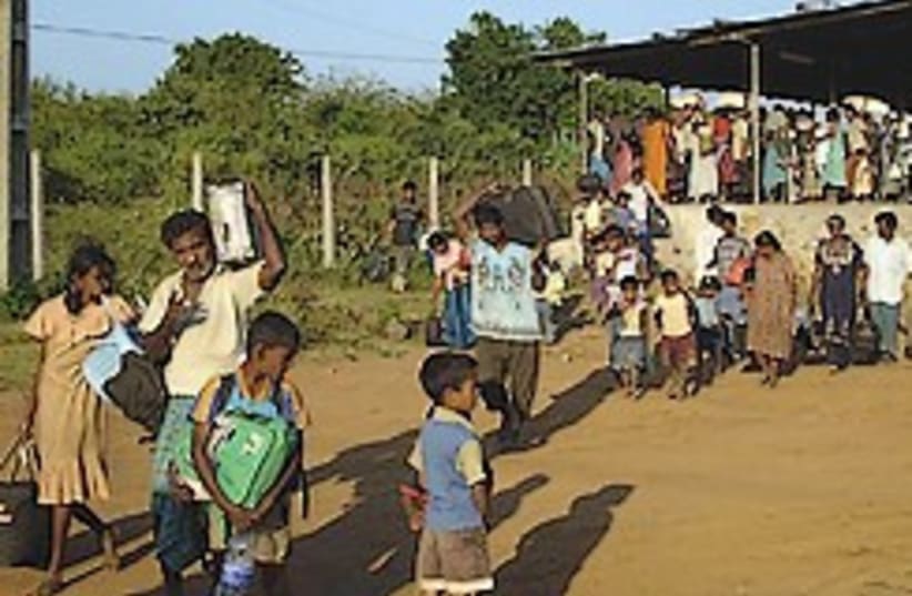 sri lankans flee 248.88 (photo credit: AP)