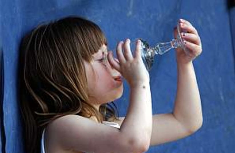 kid drinking water 298.8 (photo credit: Ariel Jerozolimski)