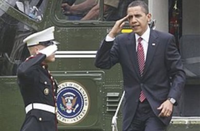 Obama salutes 248.88 (photo credit: AP)
