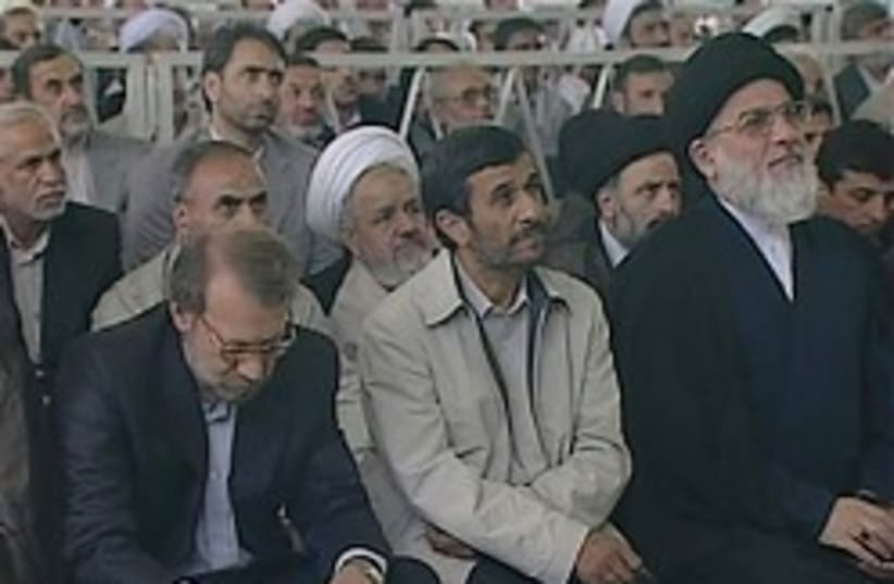 ahmadinejad listening to khamenei 248.88 (photo credit: AP)
