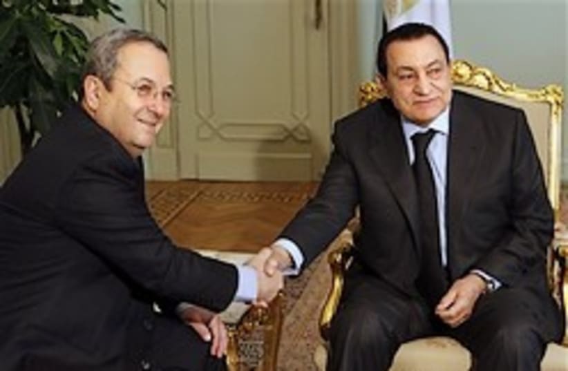 mubarak shakes hands with Barak (photo credit: )