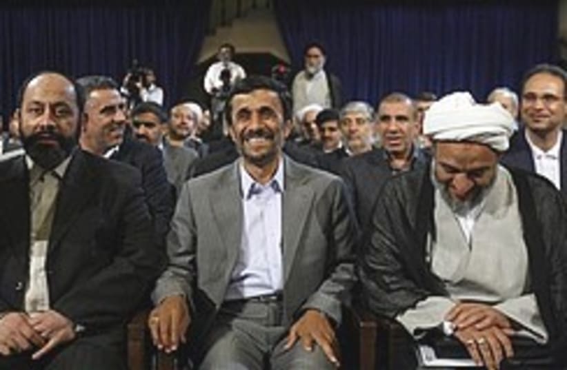 Ahmadinejad smiles with lawmakers 248.88 (photo credit: AP)