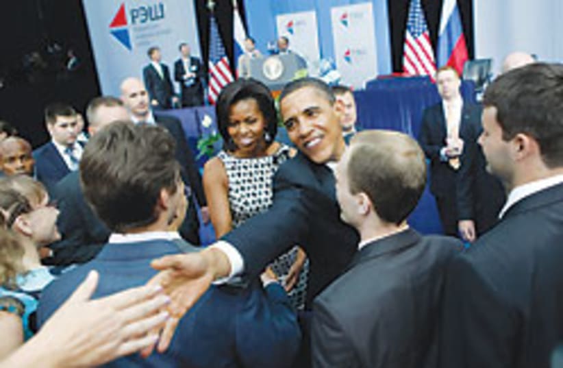 obama shakes hand 88 248 (photo credit: )