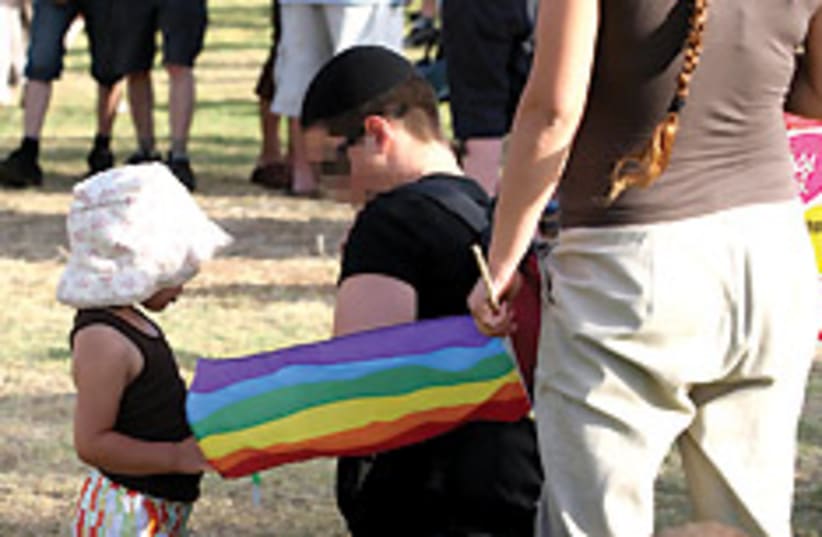 gay with child 88 248 (photo credit: Ariel Jerozolimski)