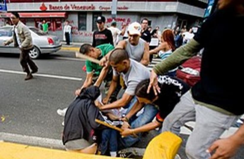 Chavez supporters attack journalist 248. (photo credit: AP)