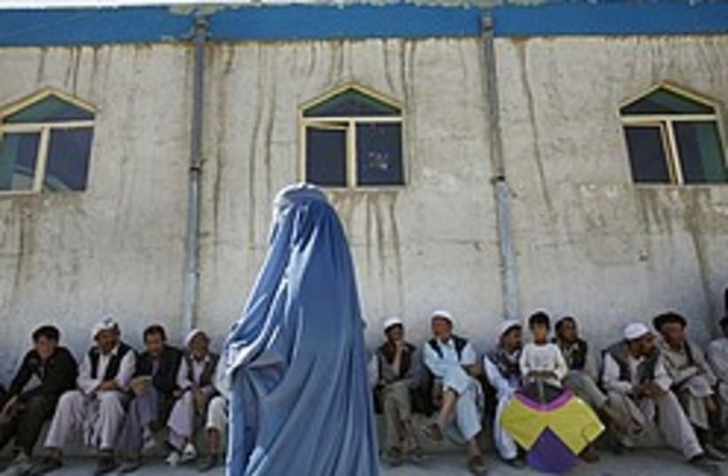 Afghan woman voter 248.88 (photo credit: )