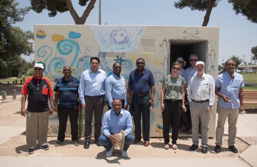 UN Ambassador Danny Danon poses with a delegation of his counterparts during their tour of Kibbutz Nahal Oz on Thursday.  (photo credit: SHAY WAGNER)