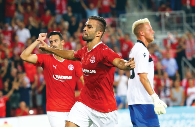 Hapoel Beersheba defender Miguel Vitor celebrates after scoring his team’s opener in last night’s 2-1 victory over Honved of Hungary in the first leg of the Champions League second qualifying round. (photo credit: UDI ZITIAT)
