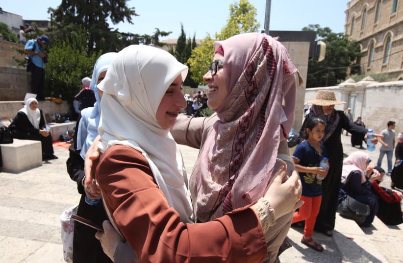 Palestinian women celebrate outside Temple Mount in Jerusalem (photo credit: MARC ISRAEL SELLEM)