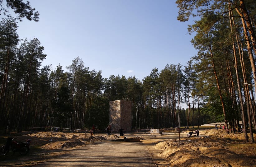 Archaeologists dig in the perimeter of a Nazi death camp (photo credit: KACPER PEMPEL / REUTERS)