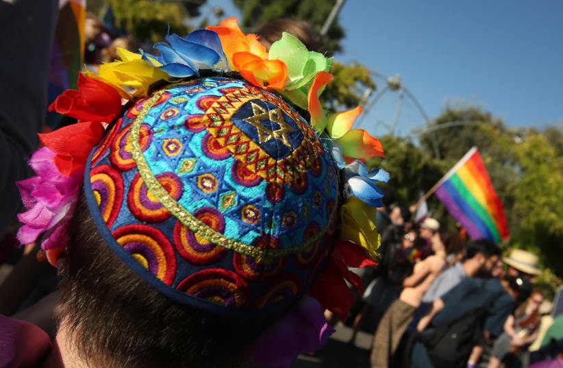 Boy wearing a colorful kippah at the Jerusalem Gay Pride Parade 2017 (photo credit: MARC ISRAEL SELLEM)