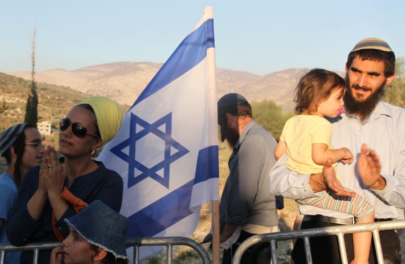 Settlers at a protest rally on the ruins of the Sa-Nur settlement in Samaria. (photo credit: TOVAH LAZAROFF)
