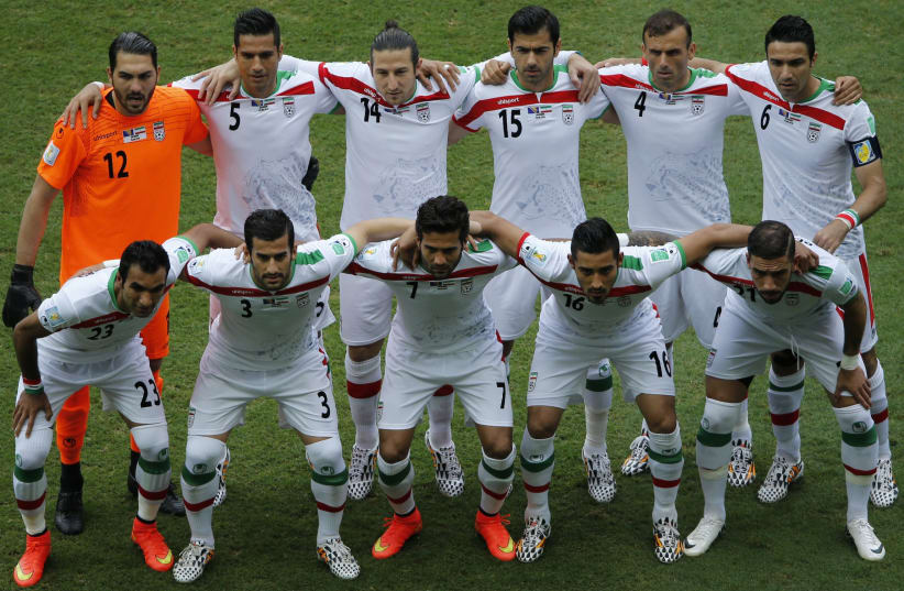 Iran's national soccer players pose for a team photo during the 2014 World Cup (photo credit: REUTERS)