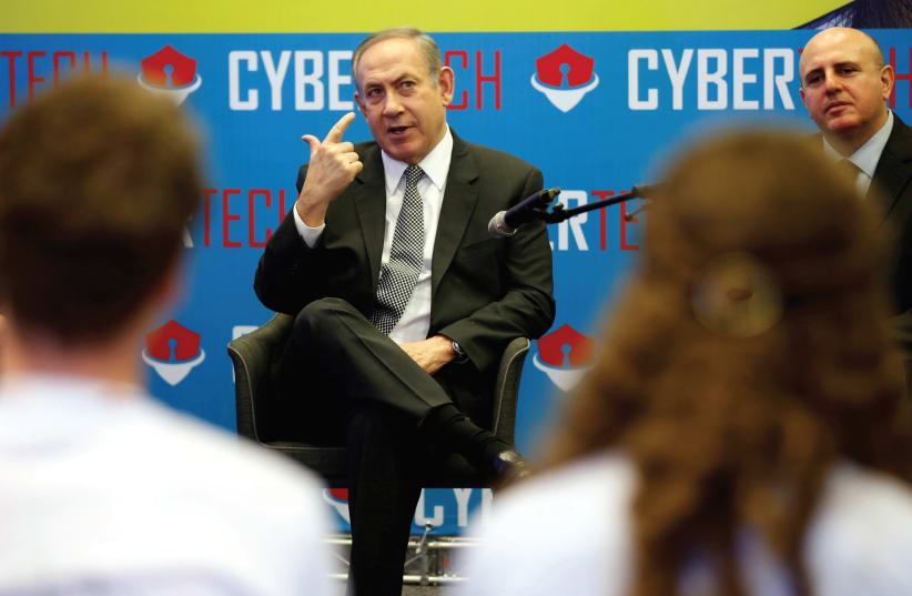 PRIME MINISTER Benjamin Netanyahu speaks to students involved in high-tech related programs during a Cyber Security Conference in Tel Aviv in January. (photo credit: REUTERS)