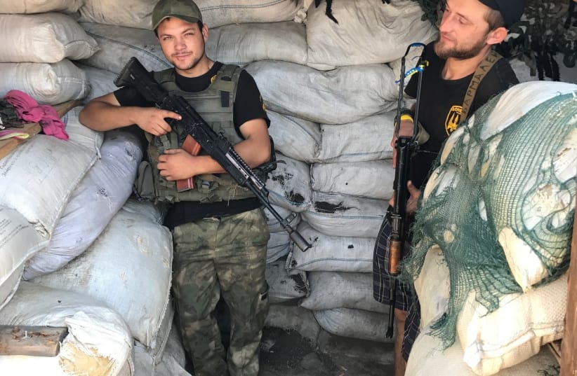 Two Ukrainian Donbas Battalion volunteers at their frontline post, Summer 2017. (photo credit: SETH J. FRANTZMAN)