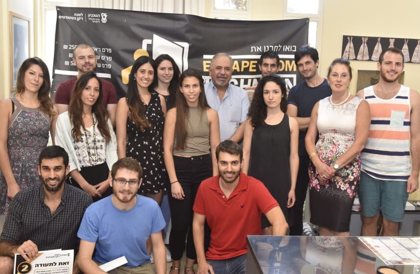 The winners of the Technion Escape Room challenge pose with Dean of Students Prf. Benny Natan (photo credit: TECHNION)