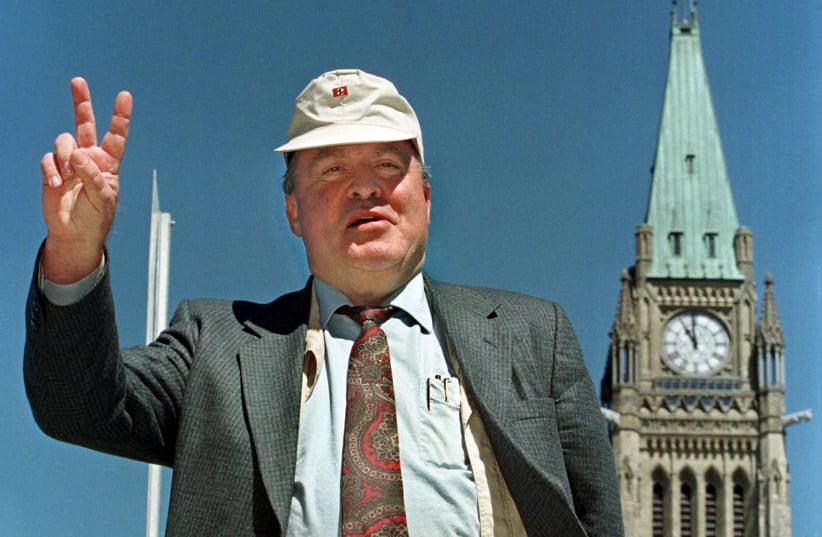 File photo of Holocaust denier Ernst Zundel leaving a news conference on the steps of Parliament Hill in Ottawa, June 5, 1998. Zundel was deported to Germany March 1, 2005, after a Federal Court judge found Zundel a threat to national security because of his connection with white supremacist and neo (photo credit: REUTERS)