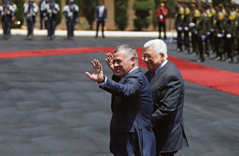 JORDAN’S KING Abdullah II and Palestinian Authority President Mahmoud Abbas (photo credit: MOHAMAD TOROKMAN/REUTERS)