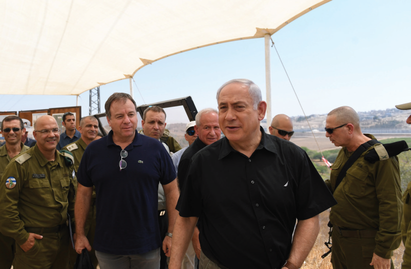 Prime minister Benjamin Netanyahu tours sections of the West Bank security barrier’s southern loop yesterday with members of the security cabinet and others.  (photo credit: GPO)