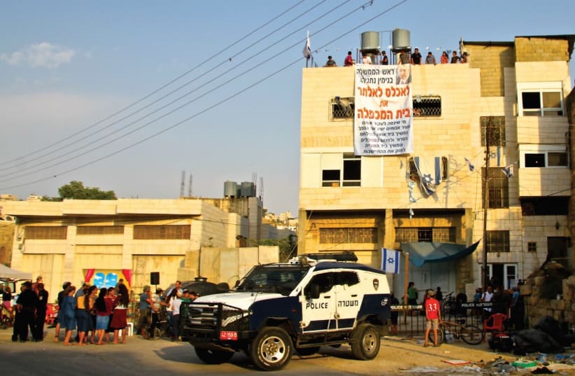 The home in Hebron currently illegally occupied by 15 settler families (photo credit: TOVAH LAZAROFF)