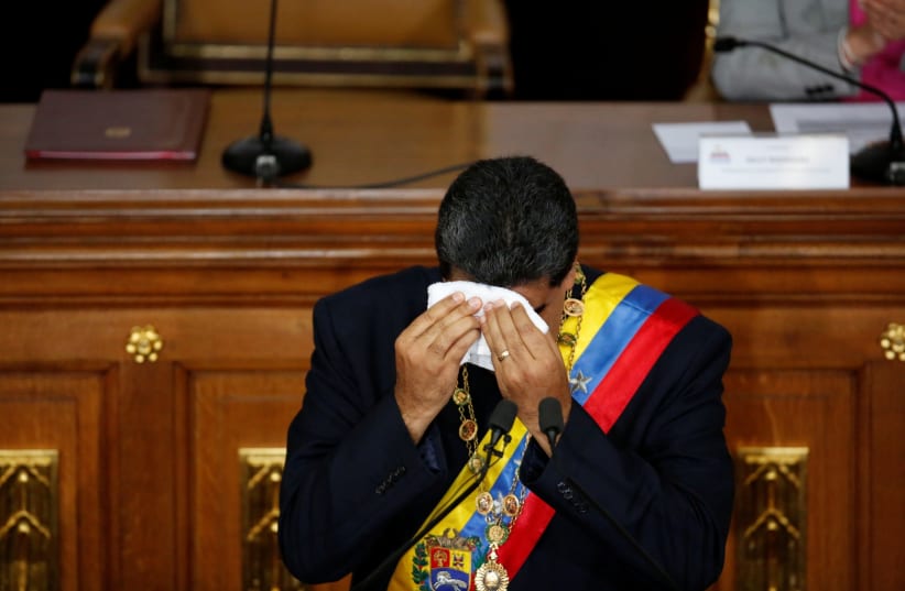 Venezuela's Presidente Nicolas Maduro wipes the sweat from his forehead during a session of the National Constituent Assembly at Palacio Federal Legislativo in Caracas, Venezuela August 10, 2017 (photo credit: CARLOS GARCIA RAWLINS/ REUTERS)
