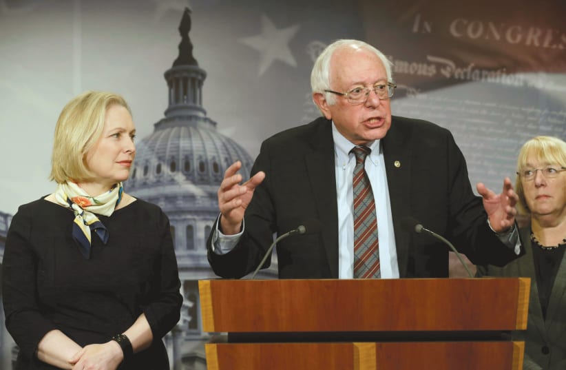 SENATOR BERNIE SANDERS speaks between Sens. Kirsten Gillibrand (left) and Patty Murray during a news conference to unveil the FAMILY Act in Washington in March (photo credit: REUTERS)