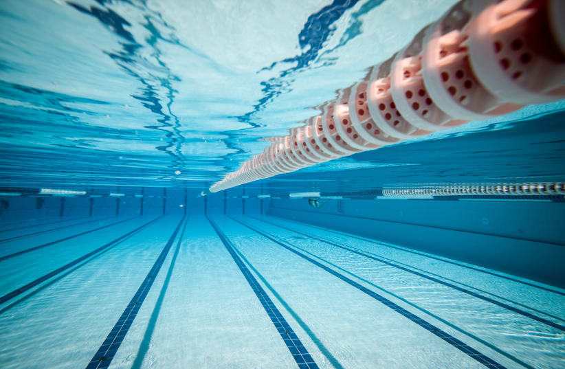 swimming pool under water illustrative (photo credit: INGIMAGE)