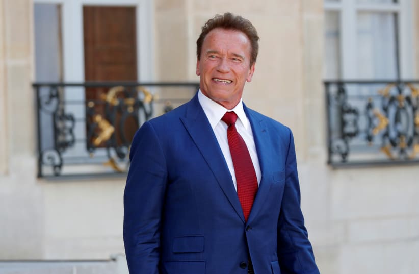Former California Governor Arnold Schwarzenegger leaves the Elysee Palace in Paris, France (photo credit: CHARLES PLATIAU / REUTERS)