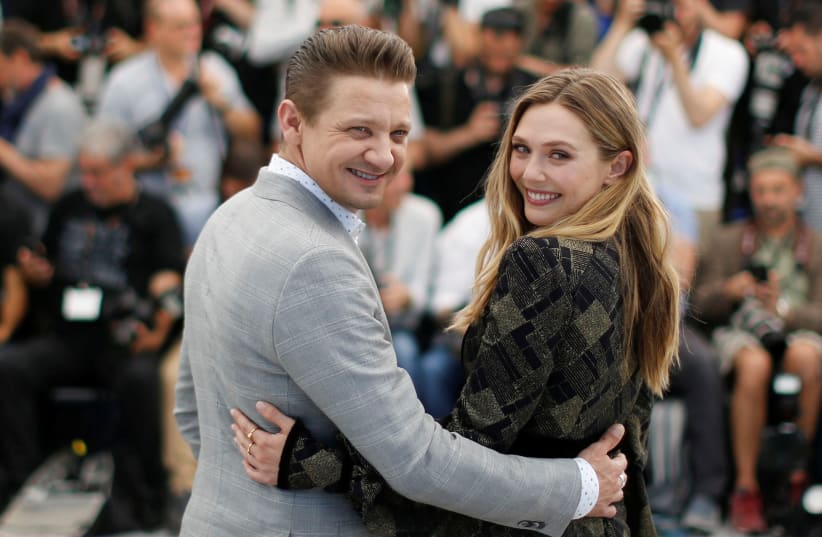 Cast members Jeremy Renner and Elizabeth Olsen pose. (photo credit: REUTERS)
