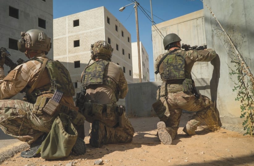 THE IDF’S ELITE Duvdevan unit and the Czech Armed Force’s 601st Special Forces Group train together recently in urban-warfare techniques at Tze’elim Army Base in the Negev. (photo credit: IDF)