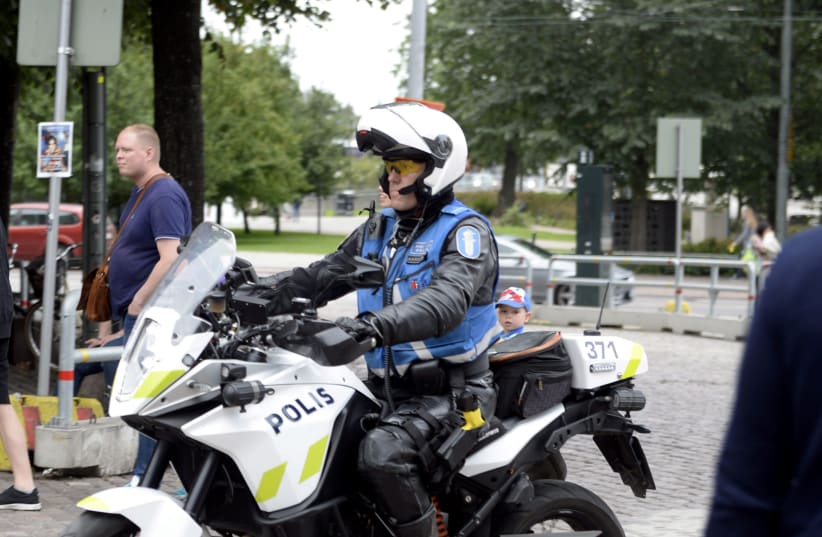 Finnish police patrols on motorbike after stabbings in Turku, in Central Helsinki, Finland August 18, 2017. (photo credit: LEHTIKUVA/LINDA MANNER VIA REUTERS)