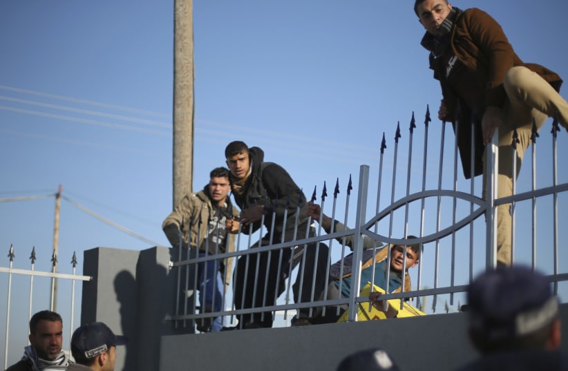 Gazans attempting to cross into Egypt at the Rafah crossing (photo credit: MOHAMMED SALEM/ REUTERS)