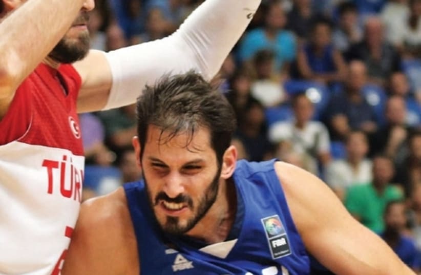 Israel forward Omri Casspi led the national team with 18 points and 10 rebounds at Yad Eliyahu Arena last night, but it wasn’t enough for the blue-andwhite, which suffered an 84-83 defeat to Turkey. (photo credit: ADI AVISHAI)