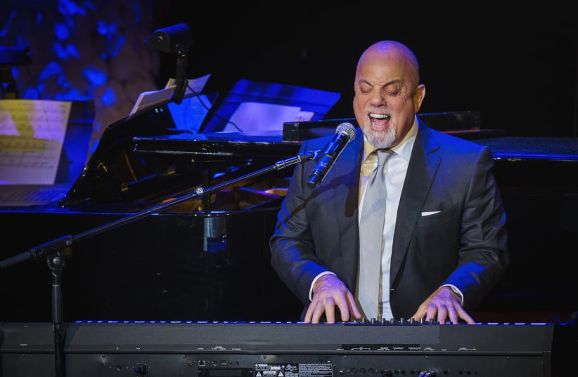 Billy Joel performs after accepting an award at the American Society of Composers, Authors and Publishers Centennial Awards in New York, November 17, 2014 (photo credit: REUTERS/LUCAS JACKSON)