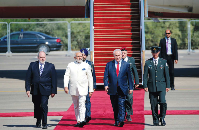 Meron Reuben joins Prime Minister Benjamin Netanyahu in welcoming Indian Prime Minister Narendra Modi to Israel on July 4. (photo credit: REUTERS)