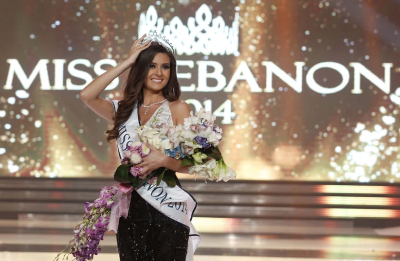 Sally Greige holds her tiara after being crowned Miss Lebanon. (photo credit: REUTERS)