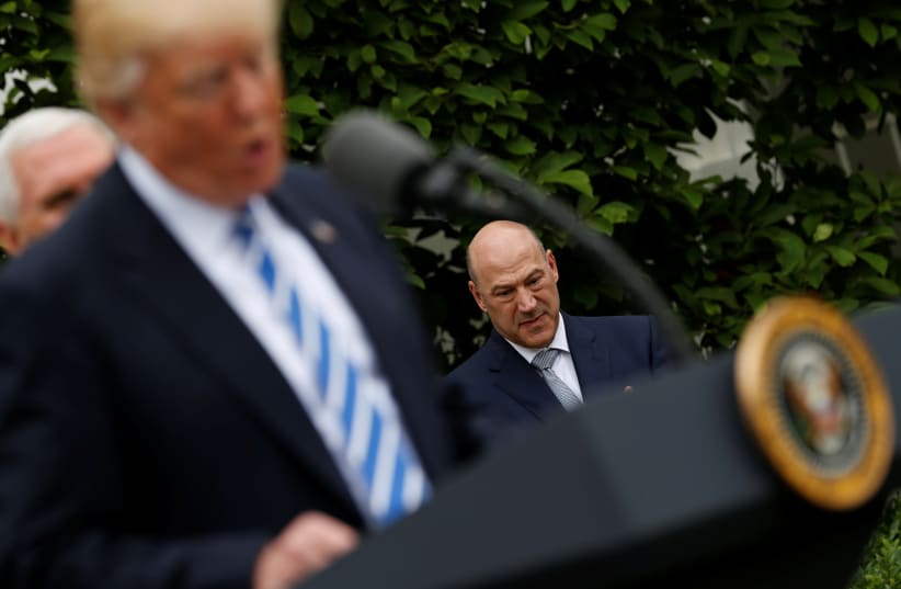 White House National Economic Council Director Gary Cohn listens as US President Donald Trump delivers remarks in the Kennedy Garden at the White House in Washington, US, May 1, 2017 (photo credit: REUTERS)