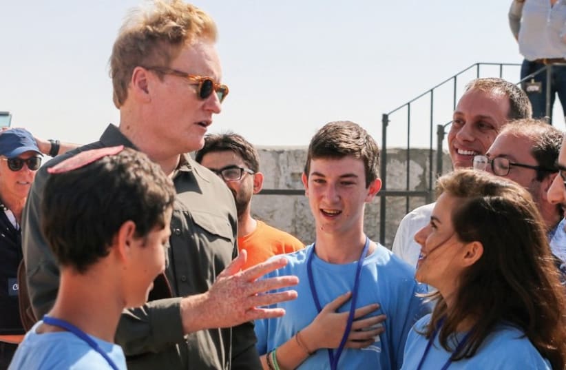 VISITING AMERICAN TV HOST and comedian Conan O’Brien interrupts high schoolers yesterday as they take part in a nonstop, 24-hour hackathon at Jerusalem’s Tower of David Museum. (photo credit: TOWER OF DAVID MUSEUM)