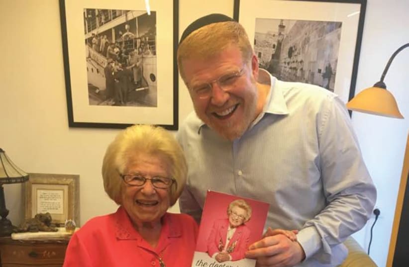 DR. RUTH with David Rozenson and her book ‘The Doctor Is In.’ (photo credit: DANA BAR SIMAN TOV)