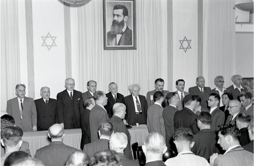 David Ben Gurion at the center as the state of Israel is declared May 14 1948 (photo credit: SCHERSCHEL FRANK/ GPO)