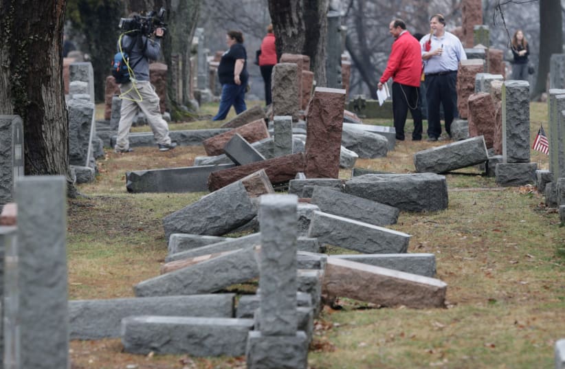 Media report on more than 170 toppled Jewish headstones after a weekend vandalism attack on Chesed Shel Emeth Cemetery in University City, a suburb of St Louis, Missouri, US, February 21, 2017.  (photo credit: REUTERS)