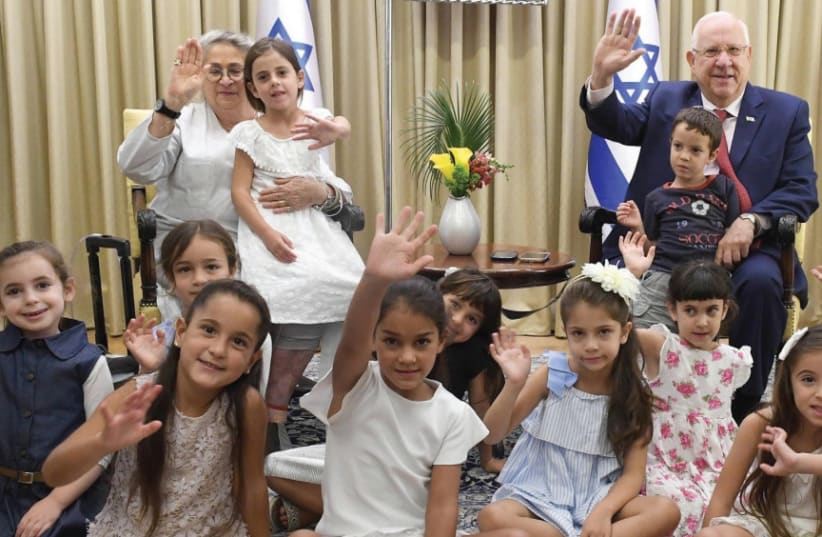 President Reuven Rivlin and his wife Nechama host the children of President’s Residence staffers who will start first grade (photo credit: Mark Neiman/GPO)