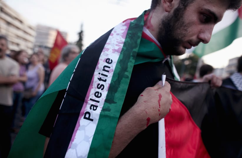 Pro-Palestinian rallier (photo credit: REUTERS/ALKIS KONSTANTINIDIS)