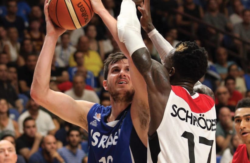 Israel forward Guy Pnini (left) had 15 points in last night’s 82-80 win over Dennis Schroder and Germany in EuroBasket action at Yad Eliyahu Arena. (photo credit: ADI AVISHAI)