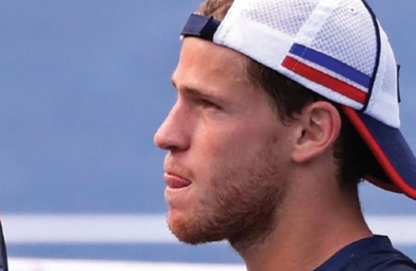 diego schwartzman lost his US Open quarterfinal match to Pablo Carreno Busta in straight sets 6-4, 6-4, 6-2 at Arthur Ashe Stadium yesterday (photo credit: REUTERS)