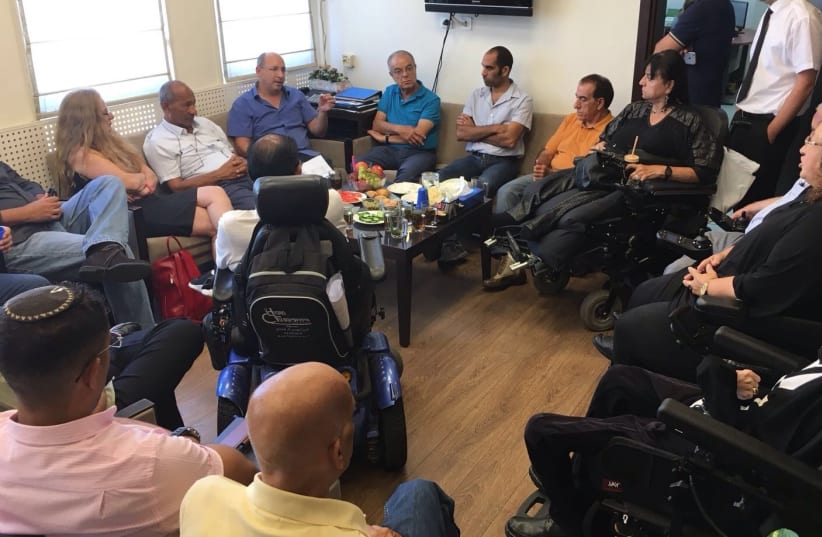 Histadrut president Avi Nissenkoren meets with leaders of the disabled community, September 5, 2017. (photo credit: DISABLED IS NOT A HALF PERSON)