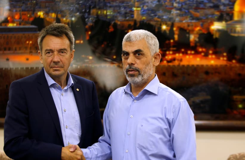 International Committee of the Red Cross (ICRC) President Peter Maurer (L) shakes hands with Hamas Gaza Chief Yehya Al-Sinwar during their meeting in Gaza City September 5, 2017. (photo credit: REUTERS)